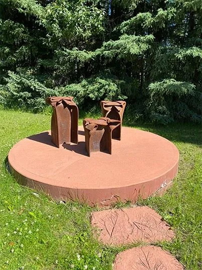 A photo of the sculpture "Happy Family" by artist Morton Burke