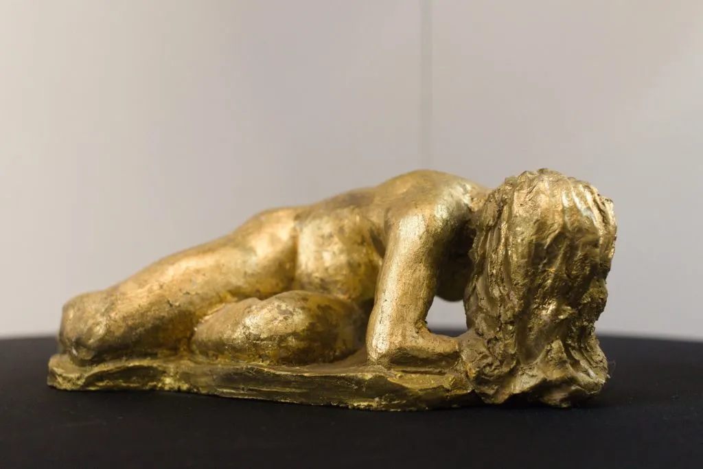 A photo of the sculpture "Golden Figure" by Keith Turnbull