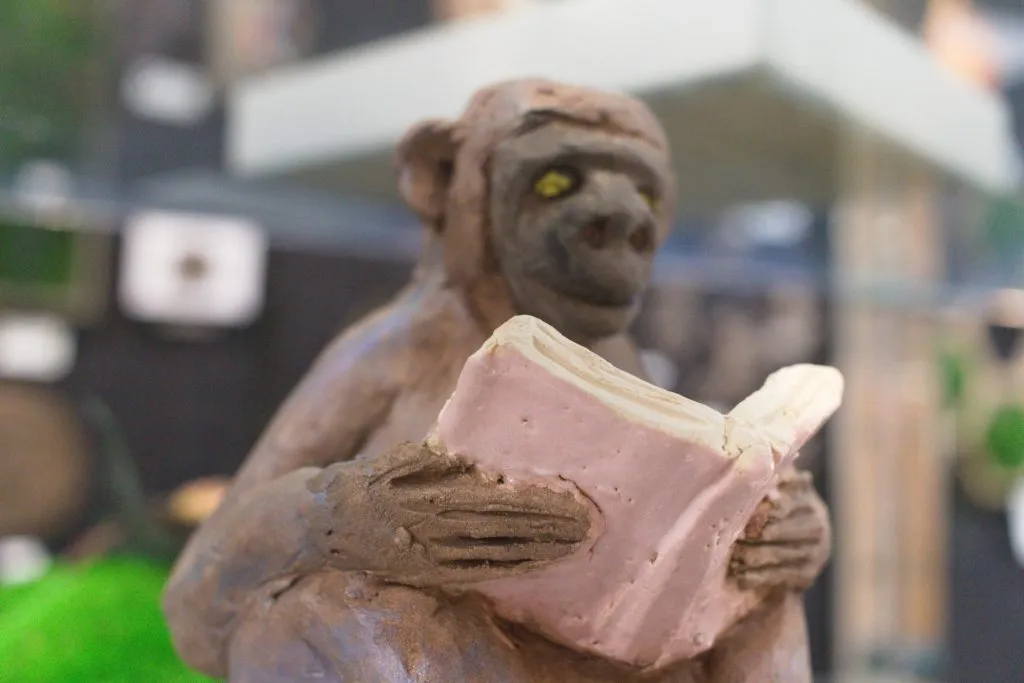 A photo of the sculpture "Reading Monkey" by Keith Turnbull